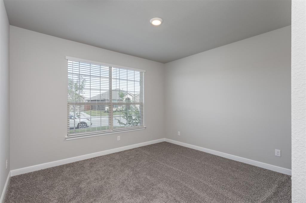 14621 Bootes Drive Haslet, TX 76052 - Photo 6 of 40 Empty room featuring carpet and baseboards
