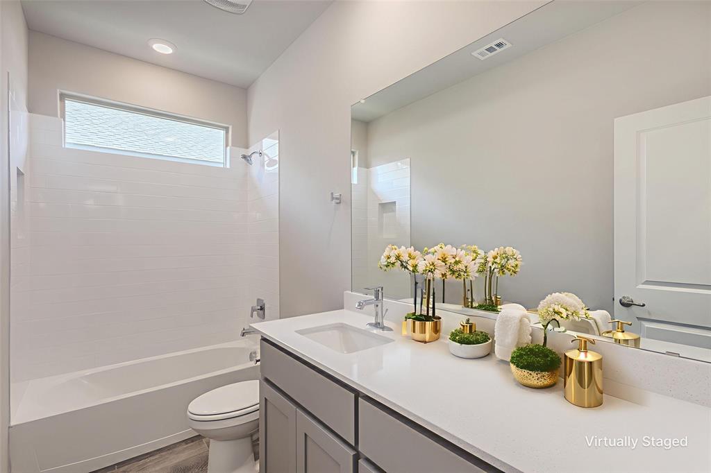14621 Bootes Drive Haslet, TX 76052 - Photo 9 of 40 Full bathroom featuring vanity, shower / washtub combination, and dark wood-style floors