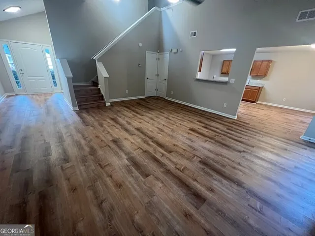 a view of a livingroom with wooden floor