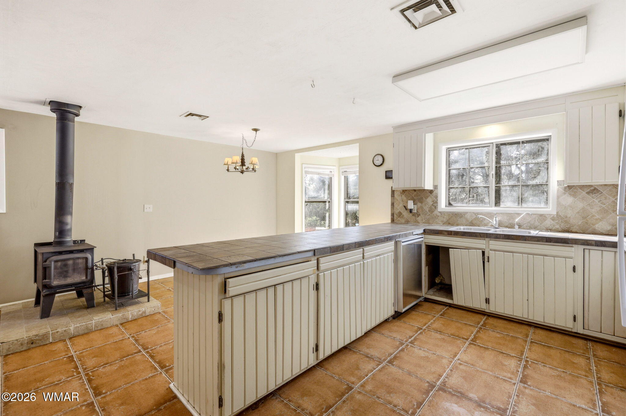 3650 Buckskin Road Overgaard, AZ 85933 - Photo 11 of 33 a kitchen with granite countertop a sink and a stove