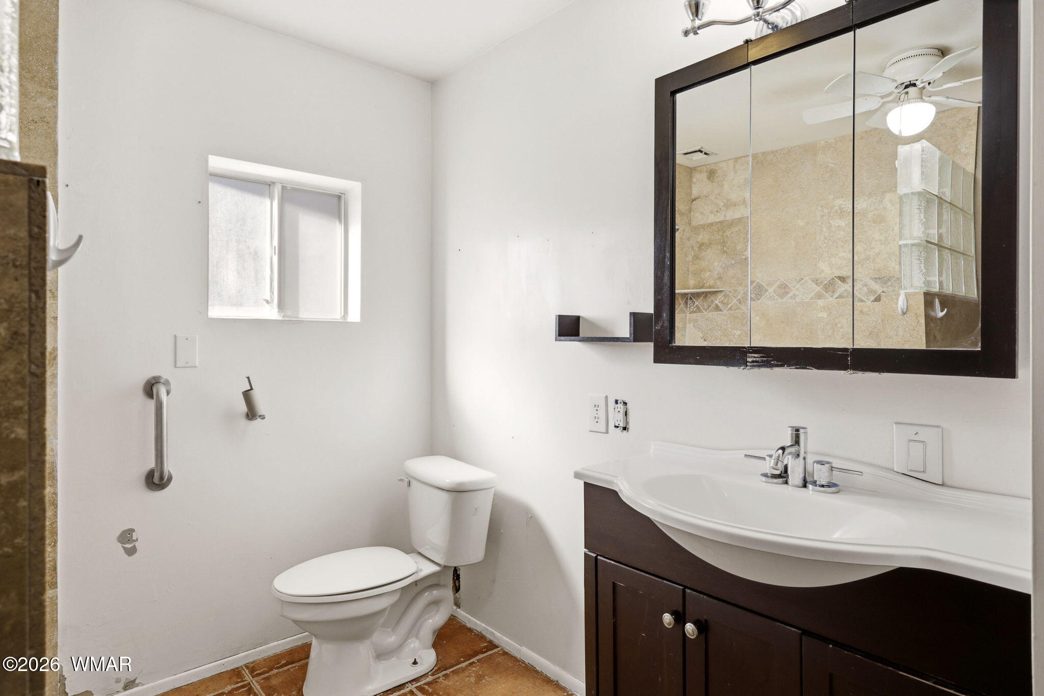 3650 Buckskin Road Overgaard, AZ 85933 - Photo 14 of 33 a bathroom with a sink a toilet and a mirror