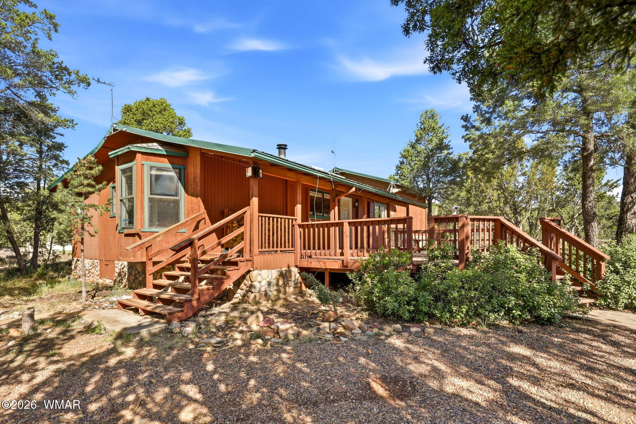 3650 Buckskin Road Overgaard, AZ 85933 - Photo 2 of 33 a view of a house with a yard