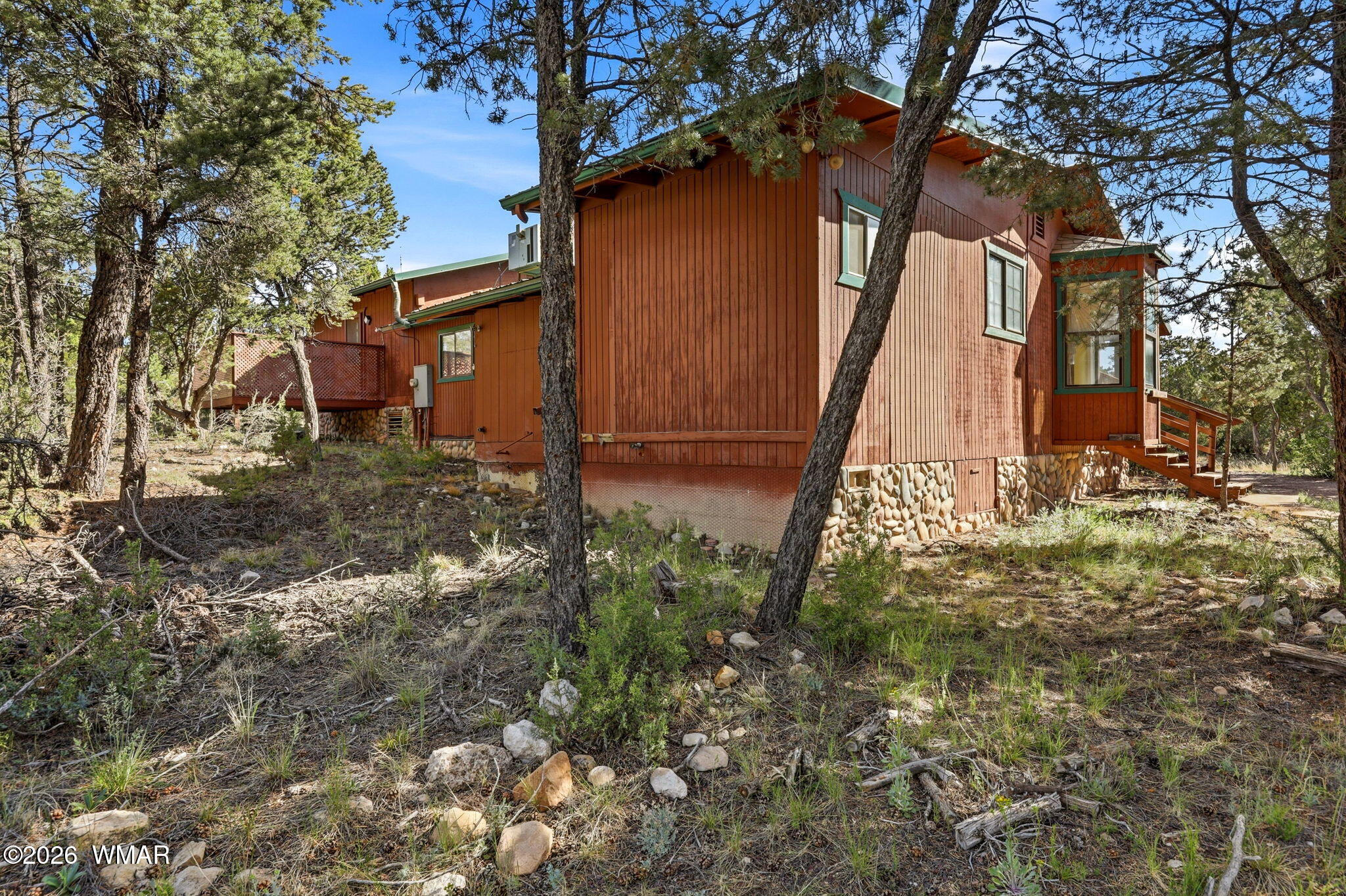 3650 Buckskin Road Overgaard, AZ 85933 - Photo 22 of 33 a backyard of a house with lots of green space
