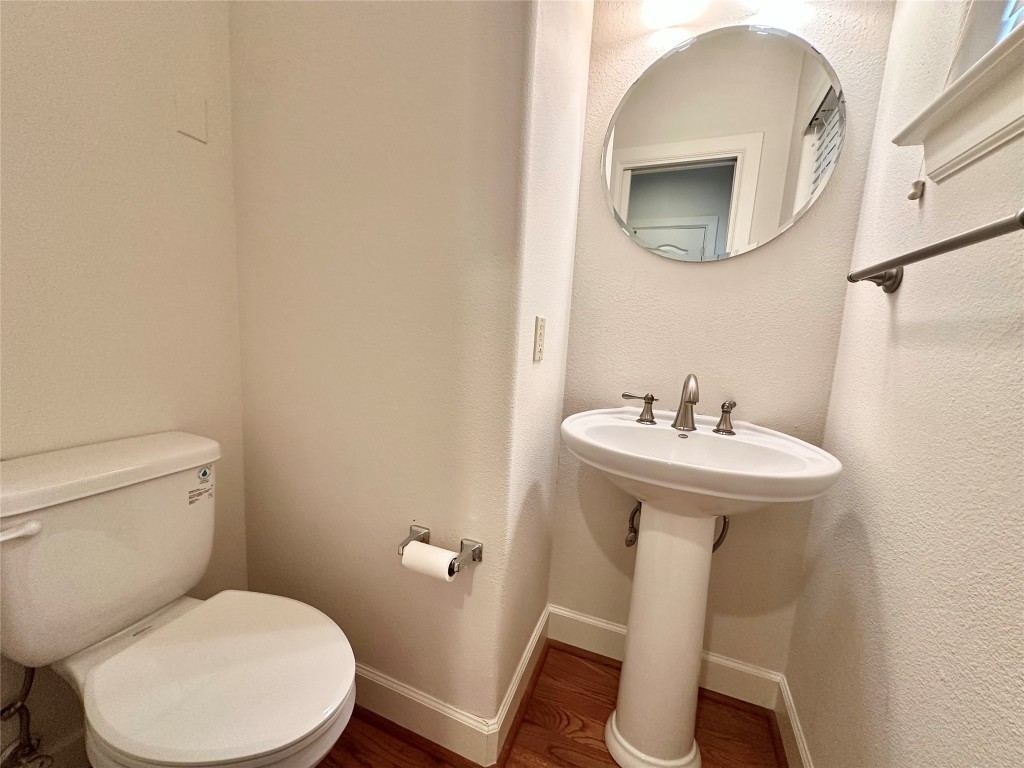 1602 Elgin Street, Unit 13 Houston, TX 77004 - Photo 16 of 22 a bathroom with a sink toilet and mirror