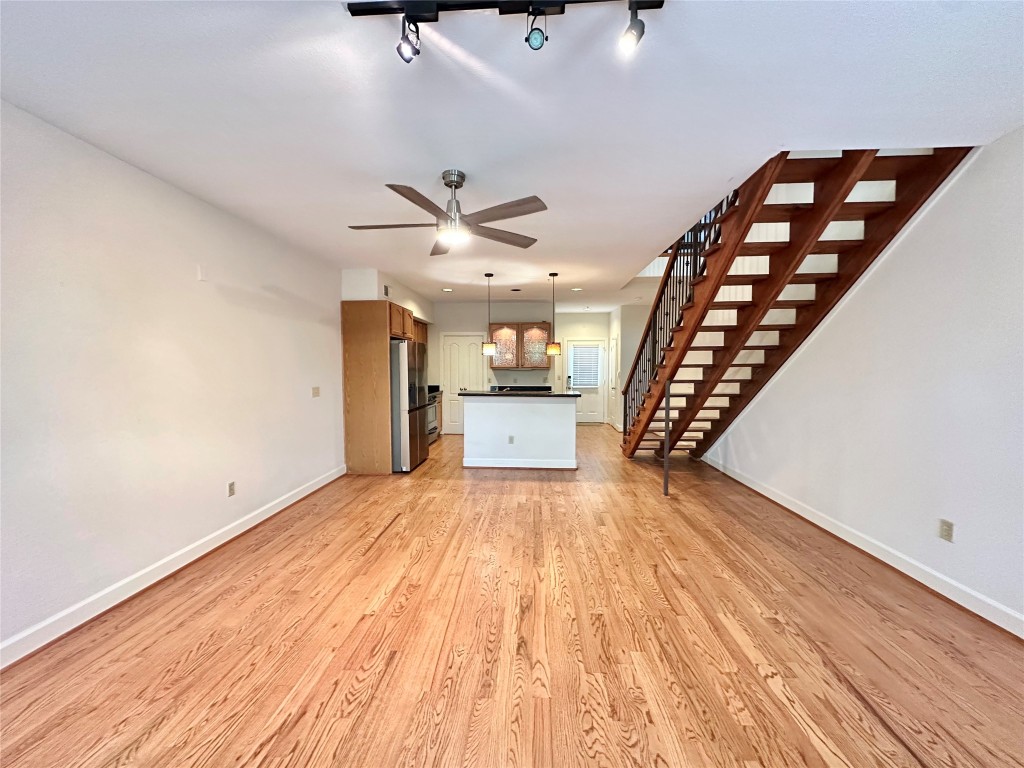 1602 Elgin Street, Unit 13 Houston, TX 77004 - Photo 2 of 22 wooden floor in an empty room with a window