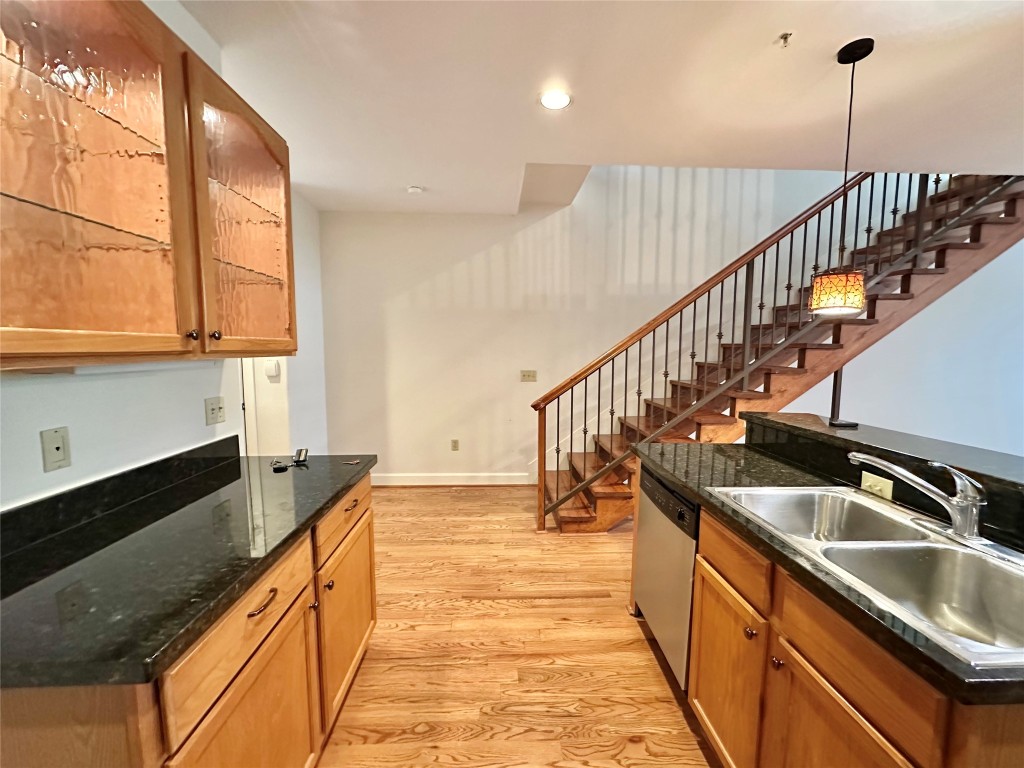 1602 Elgin Street, Unit 13 Houston, TX 77004 - Photo 5 of 22 a view of a kitchen with kitchen island a large window a sink and a counter top space