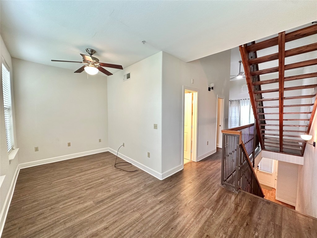 1602 Elgin Street, Unit 13 Houston, TX 77004 - Photo 7 of 22 wooden floor in an empty room with a window