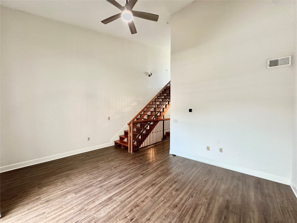 1602 Elgin Street, Unit 13 Houston, TX 77004 - Photo 10 of 22 an empty room with wooden floor fan and windows