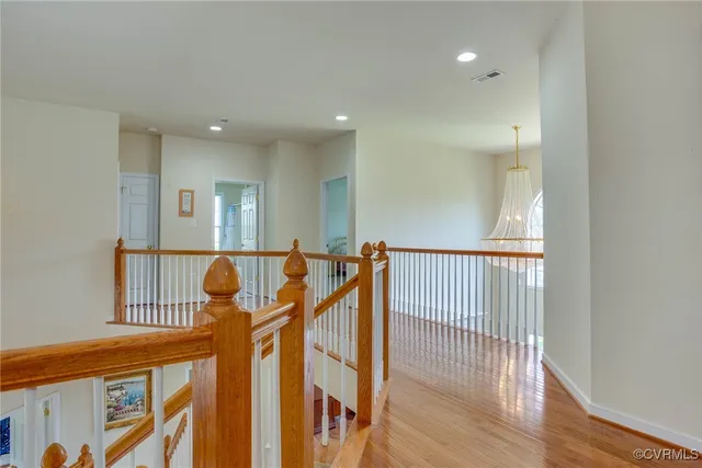 a view of an entryway with wooden floor