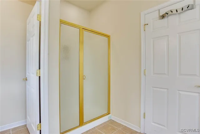 a view of a bathroom with a shower and a sink