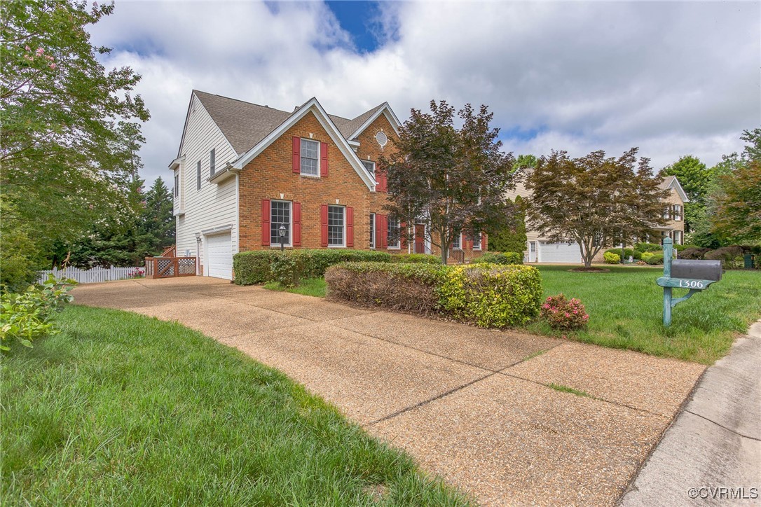 1306 Bach Terrace Midlothian, VA 23114 - Photo 3 of 50 a front view of a house with yard and green space