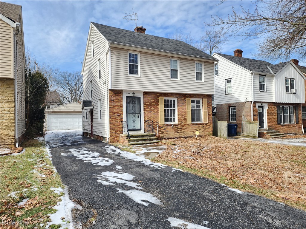 1160 Brentwood Road Cleveland, OH 44121 - Photo 2 of 26 View of front facade featuring a two car garage