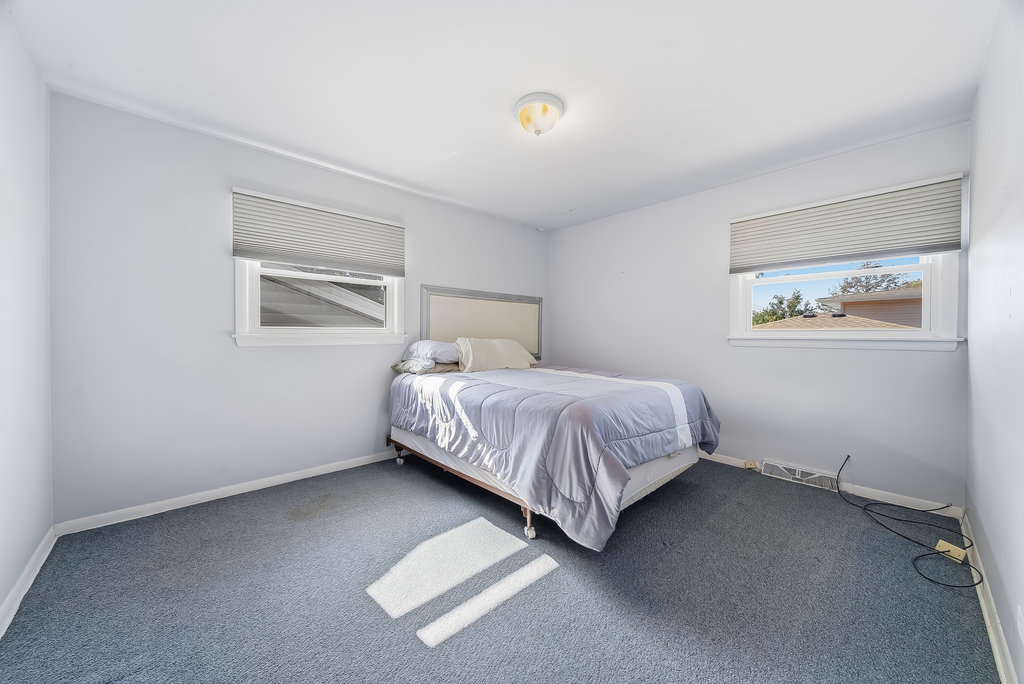 178 West Normandy Drive Chicago Heights, IL 60411 - Photo 14 of 19 a bedroom with a bed and painting on the wall