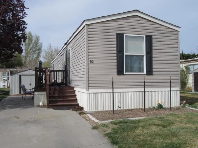 3251 E Road, Unit 99 Clifton, CO 81520 - Photo 3 of 25 a view of a house with a yard