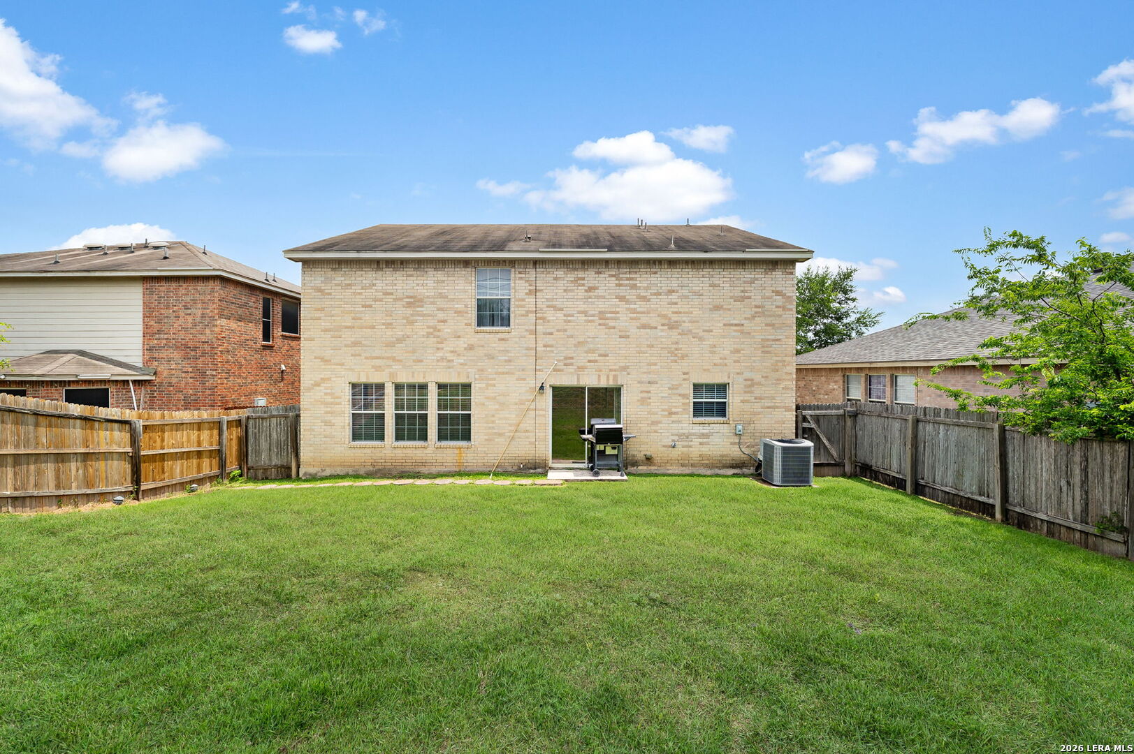 7207 Avery Road Live Oak, TX 78233 - Photo 32 of 32 a view of a house with a yard and sitting area