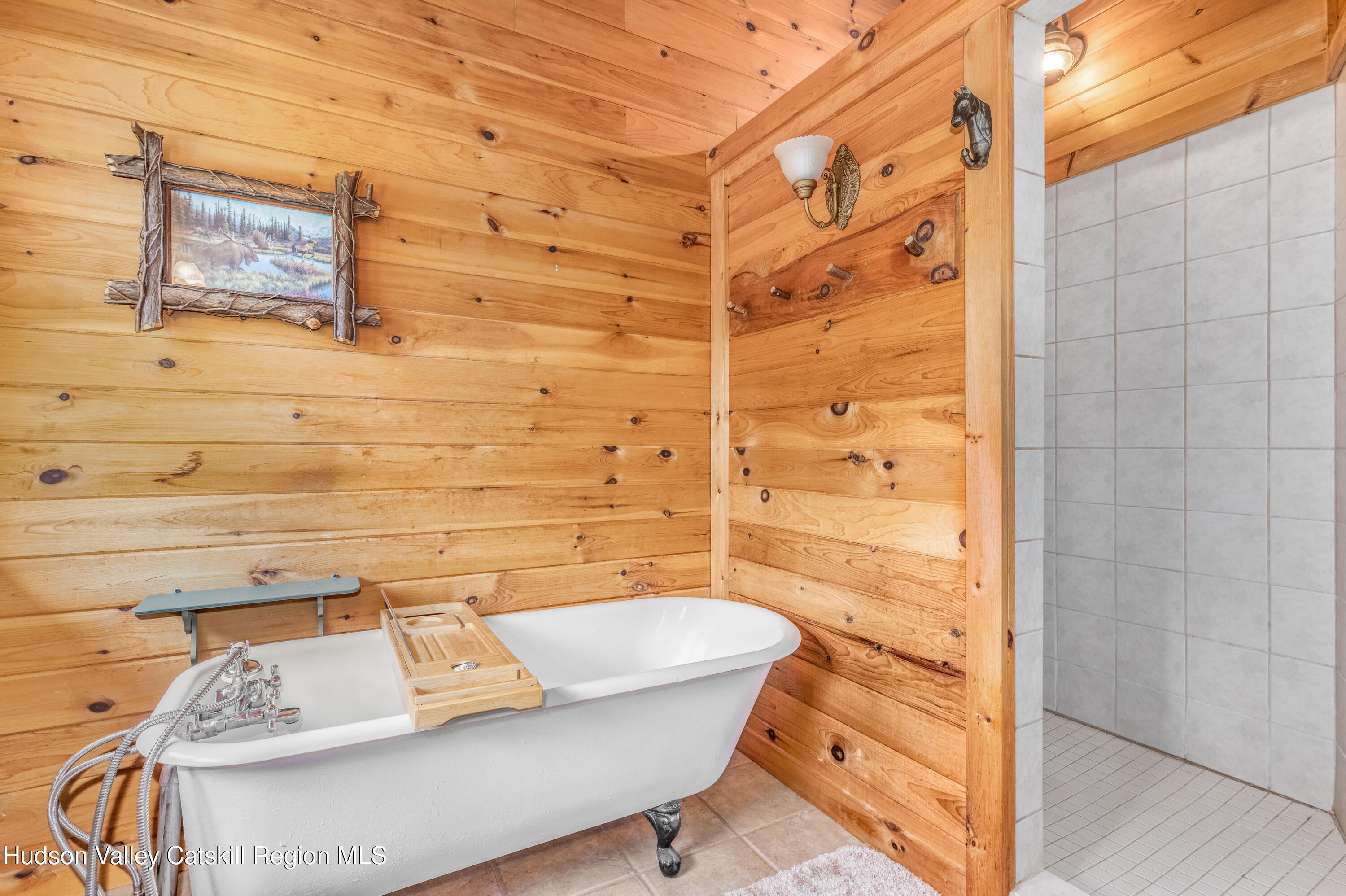 688 Bruce Porn Road Gilboa, NY 12167 - Photo 72 of 104 a bathroom with a bathtub and shower