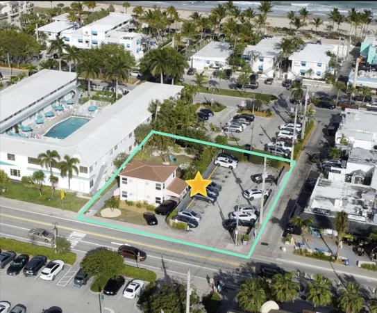 an aerial view of residential houses and outdoor space