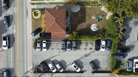 an aerial view of a house with swimming pool and outdoor space