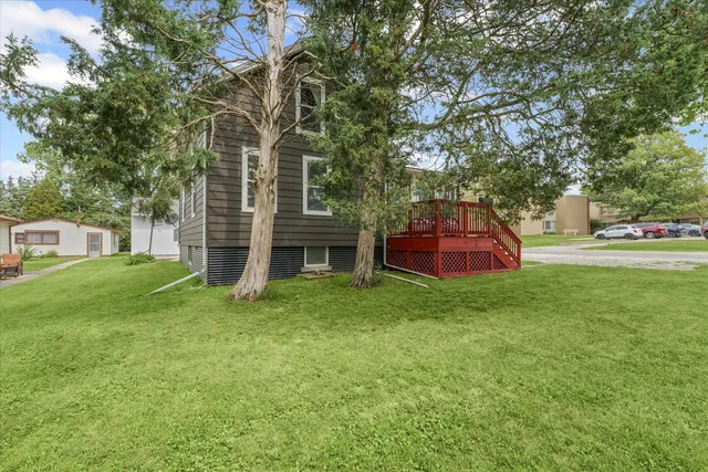a view of a house with a backyard