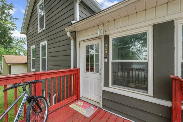 a view of a two chairs in the balcony
