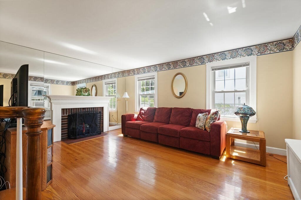 169 Ashcroft Road Medford, MA 02155 - Photo 11 of 33 a living room with furniture and a fireplace