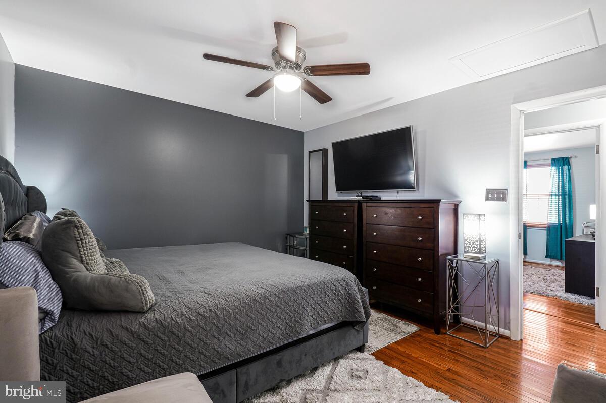 15937 Livingston Road Accokeek, MD 20607 - Photo 16 of 35 a bedroom with a bed and a flat screen tv