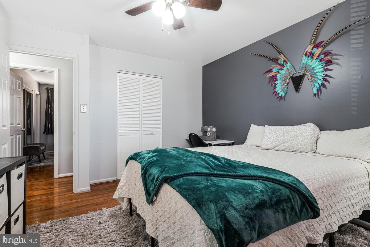 15937 Livingston Road Accokeek, MD 20607 - Photo 20 of 35 a bedroom with a bed and a chandelier