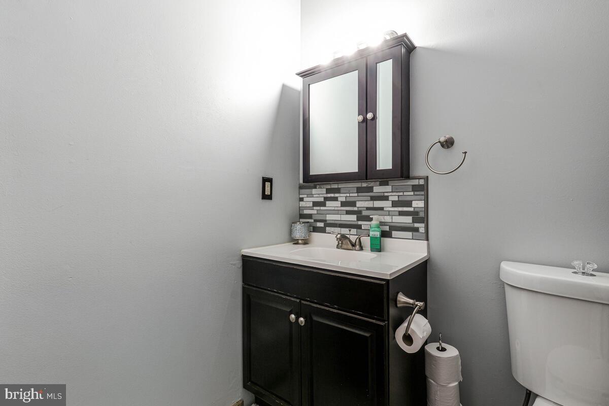 15937 Livingston Road Accokeek, MD 20607 - Photo 21 of 35 a bathroom with a sink toilet and mirror