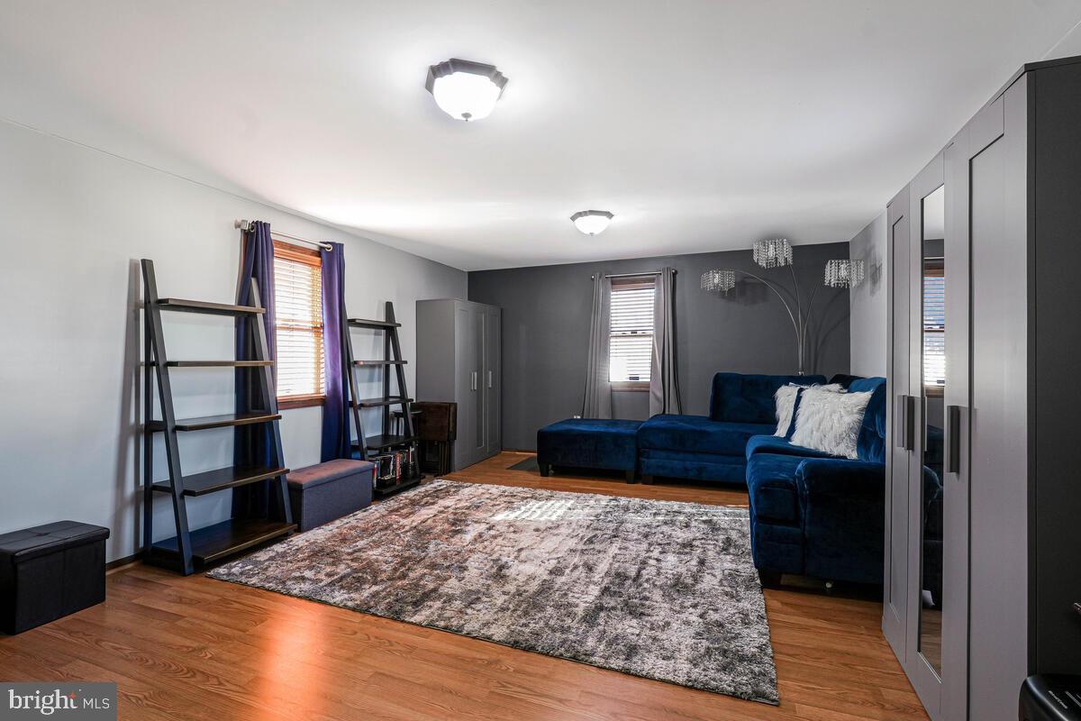 15937 Livingston Road Accokeek, MD 20607 - Photo 23 of 35 a living room with furniture and a wooden floor