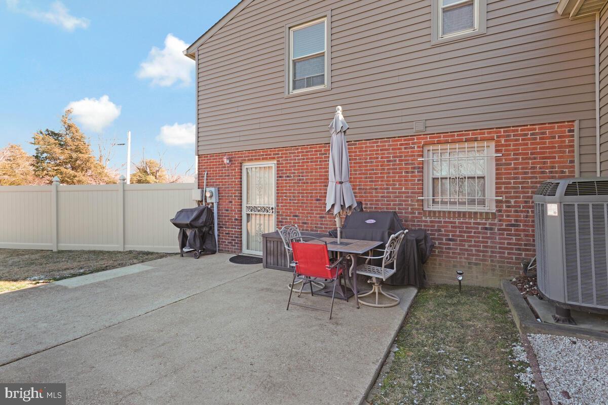 15937 Livingston Road Accokeek, MD 20607 - Photo 29 of 35 a view of a patio with a table and chairs and potted plants
