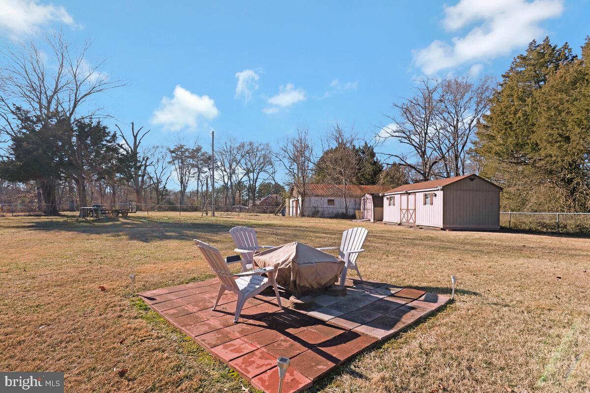 15937 Livingston Road Accokeek, MD 20607 - Photo 33 of 35 a view of a swimming pool with lounge chairs in the patio
