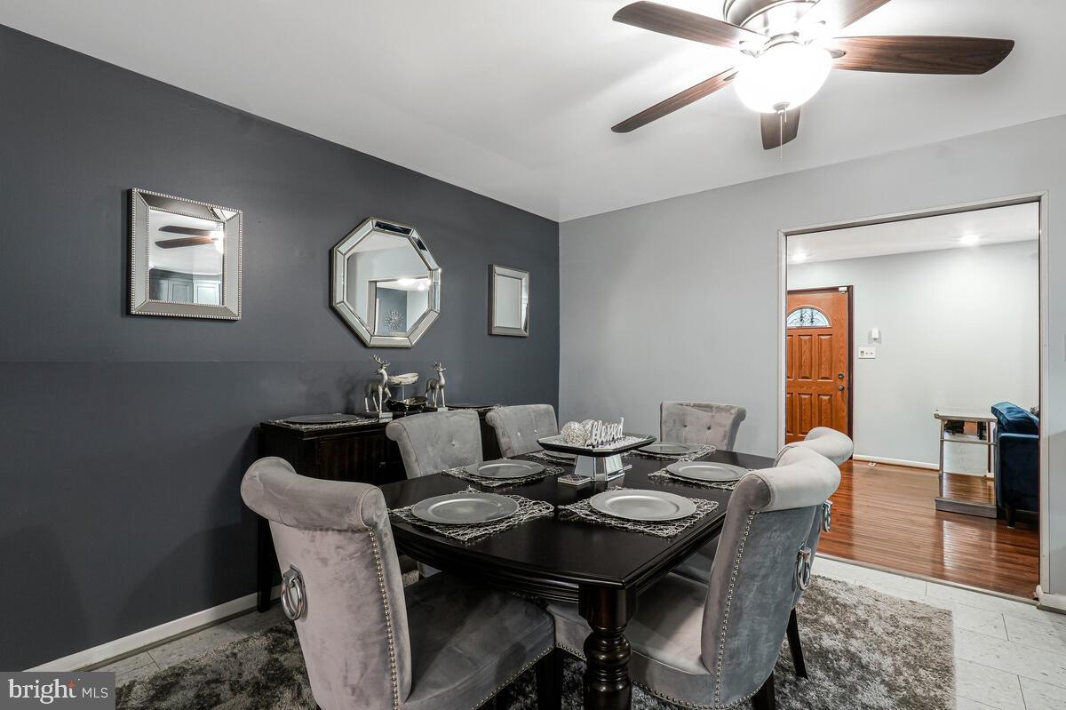 15937 Livingston Road Accokeek, MD 20607 - Photo 9 of 35 a view of a dining room with a table and chairs