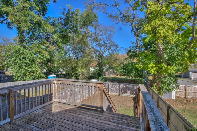 a view of deck and deck with wooden floor and fence