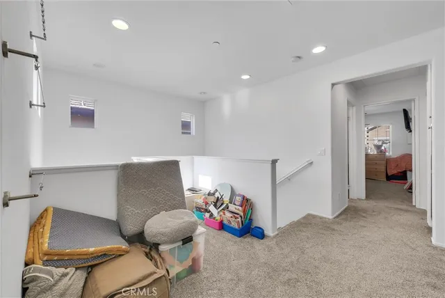 a living room with furniture and closet