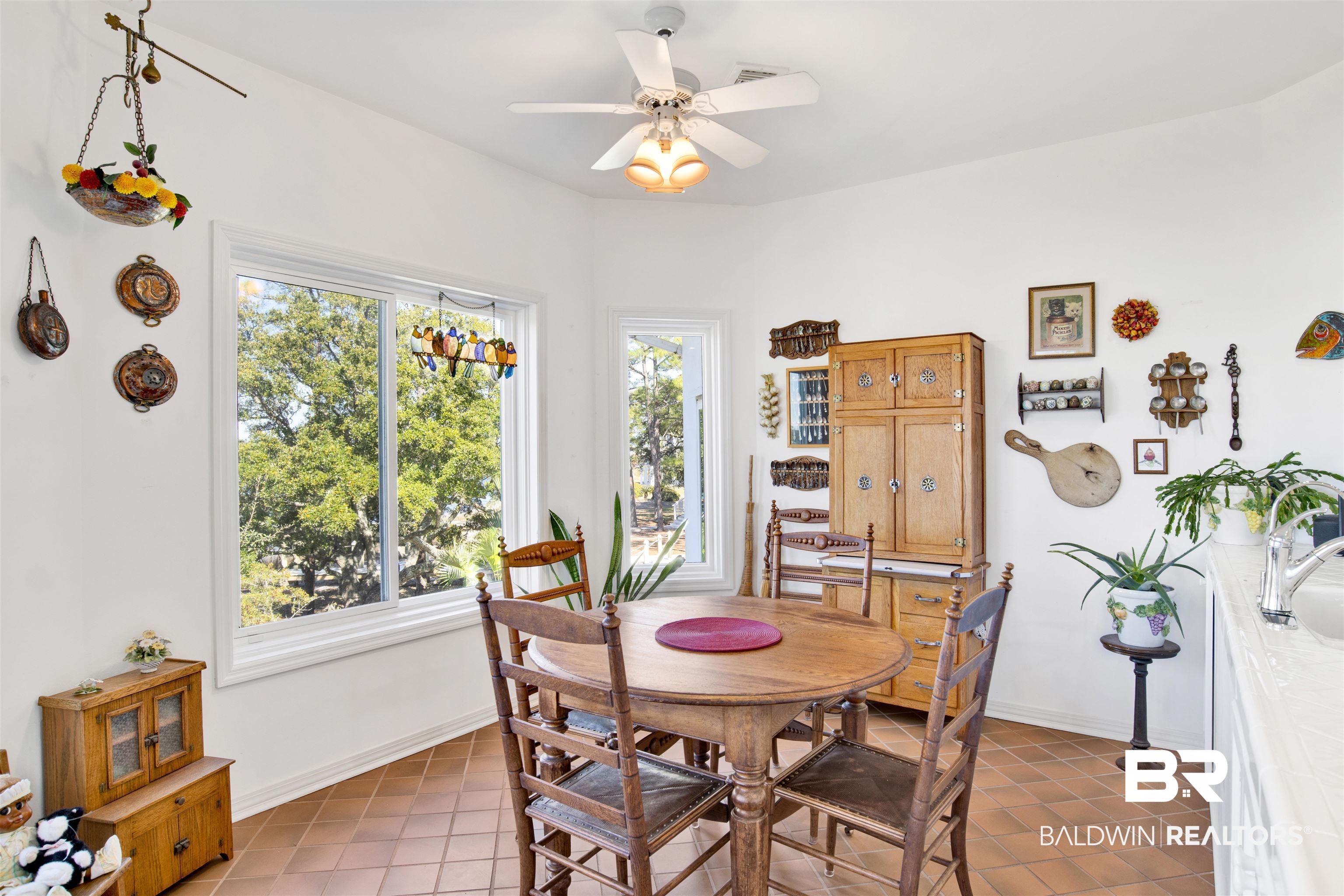 33301 River Road, Unit 25 Orange Beach, AL 36561 - Photo 12 of 44 Tiled dining space featuring ceiling fan and baseboards