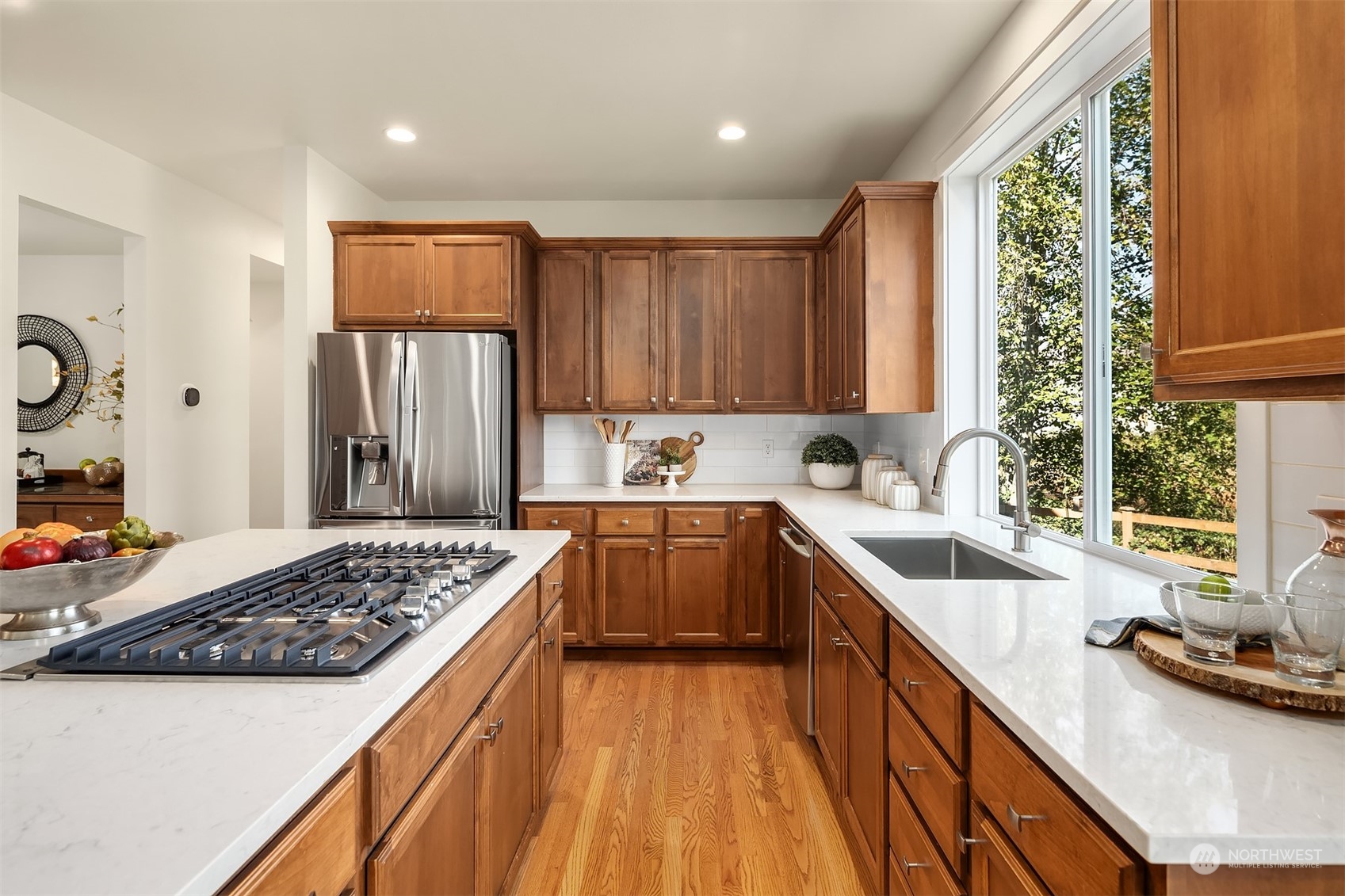 16529 38th Avenue Southeast Bothell, WA 98012 - Photo 15 of 40 a kitchen with a sink stove and refrigerator