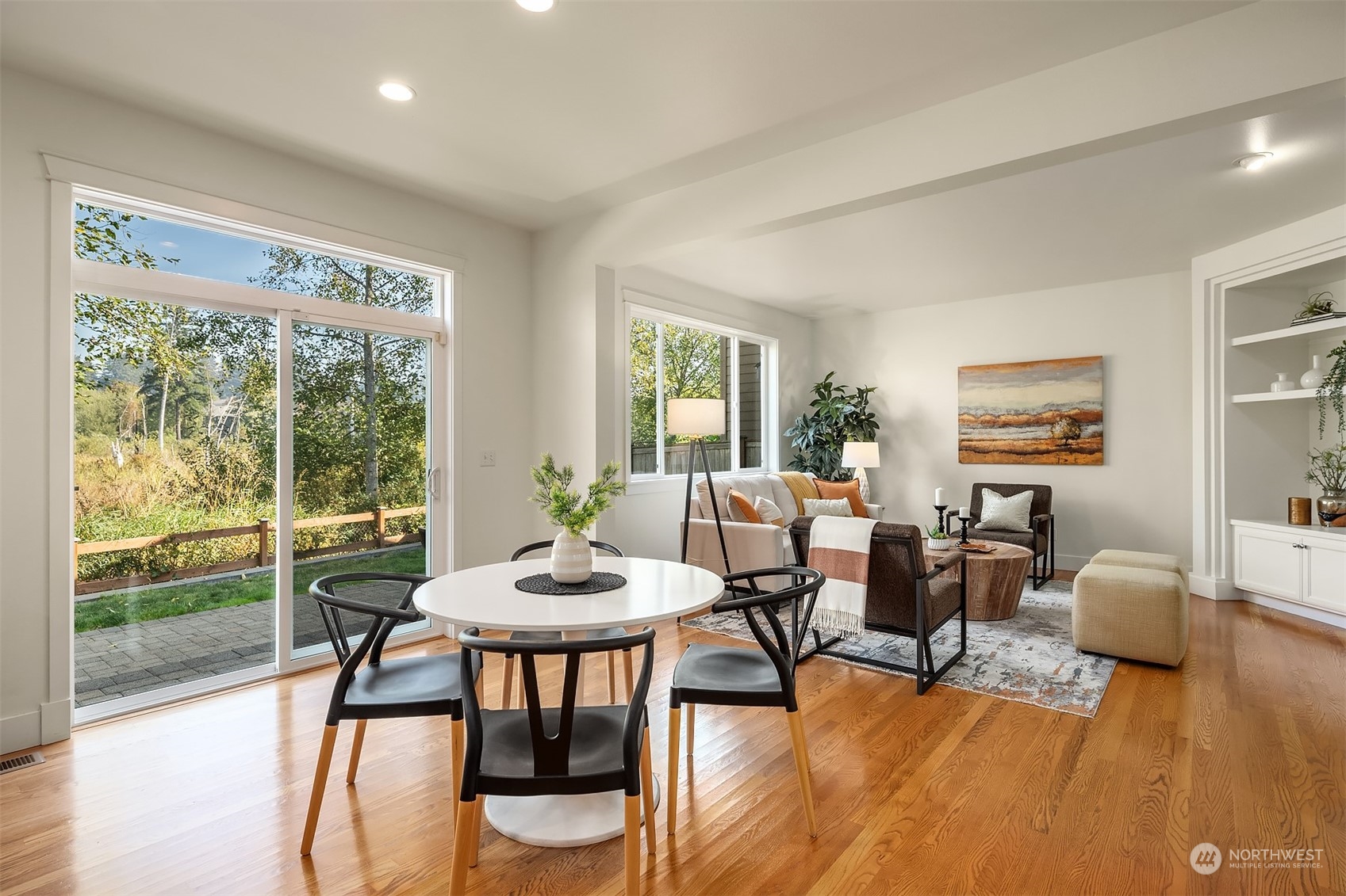 16529 38th Avenue Southeast Bothell, WA 98012 - Photo 19 of 40 a view of a dining room with furniture window and wooden floor
