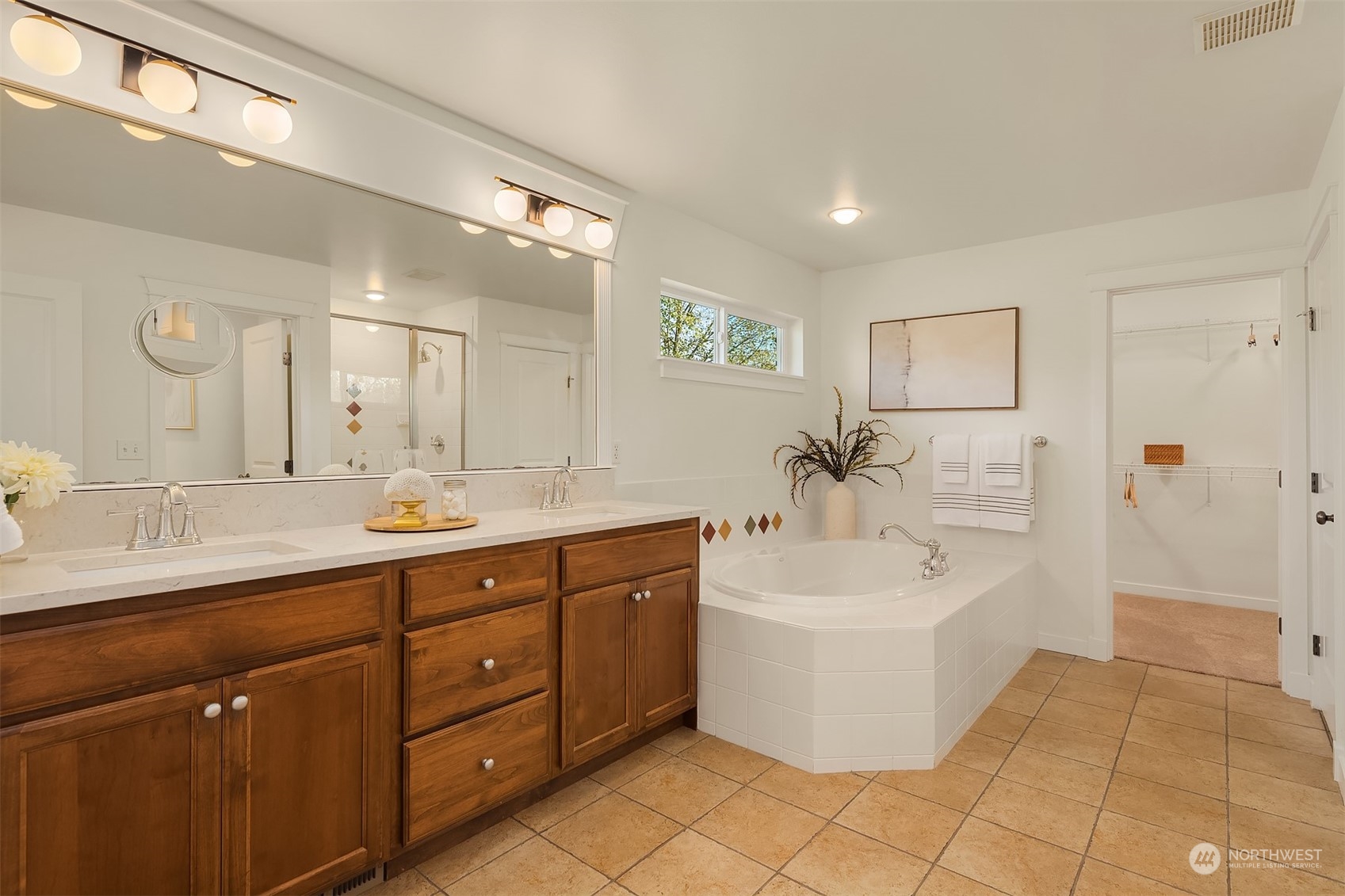 16529 38th Avenue Southeast Bothell, WA 98012 - Photo 28 of 40 a spacious bathroom with a double vanity sink mirror and bathtub