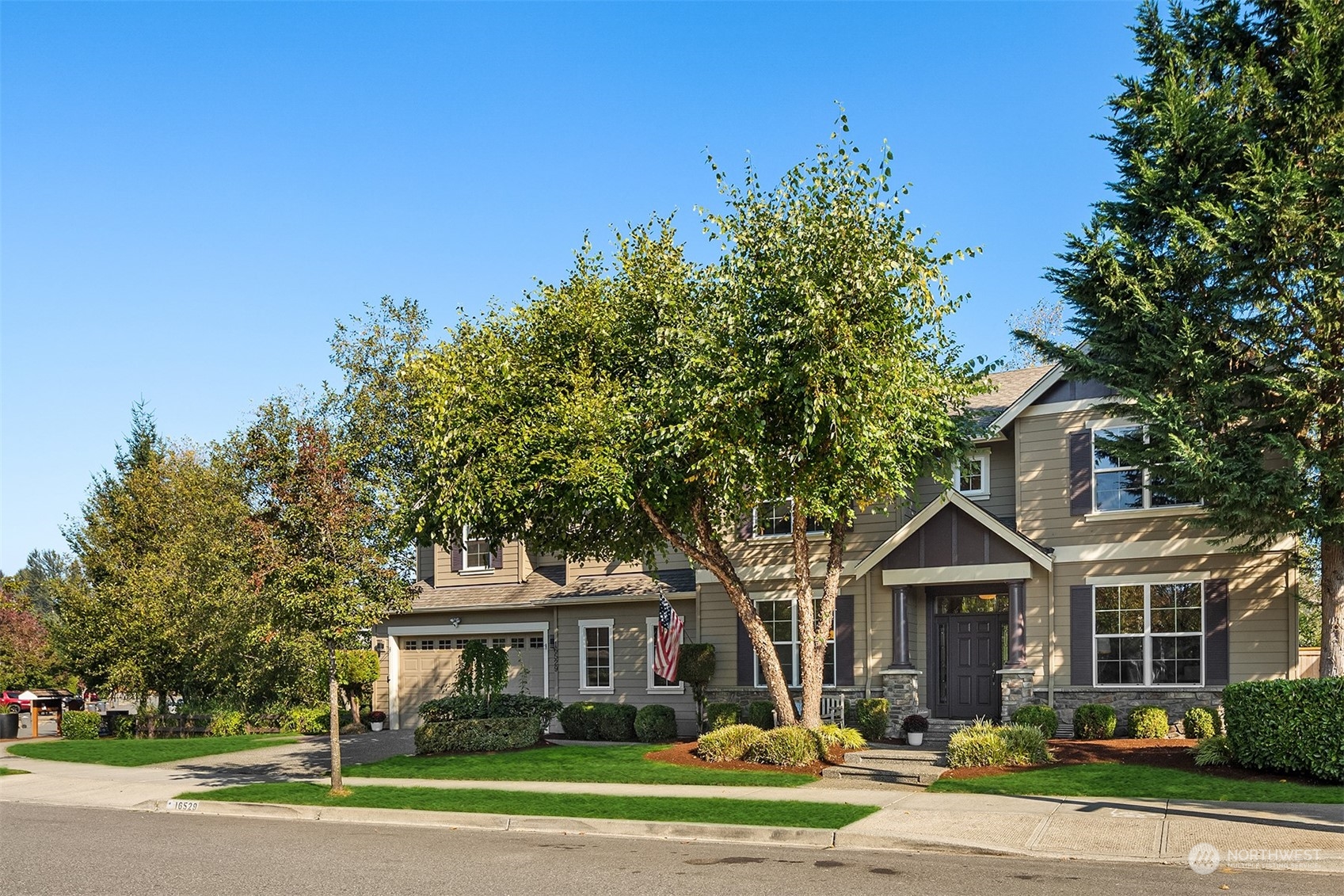 16529 38th Avenue Southeast Bothell, WA 98012 - Photo 3 of 40 a front view of a house with a yard