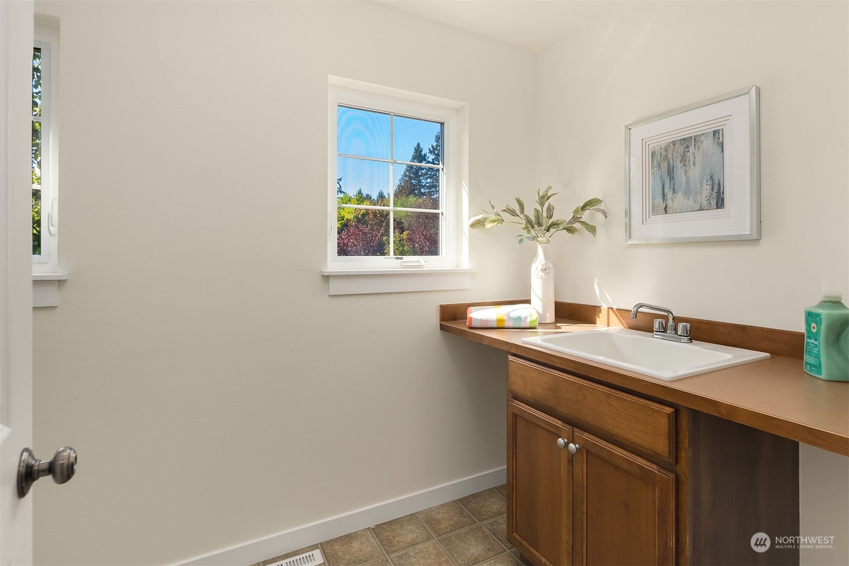 16529 38th Avenue Southeast Bothell, WA 98012 - Photo 32 of 40 a bathroom with a sink and a mirror