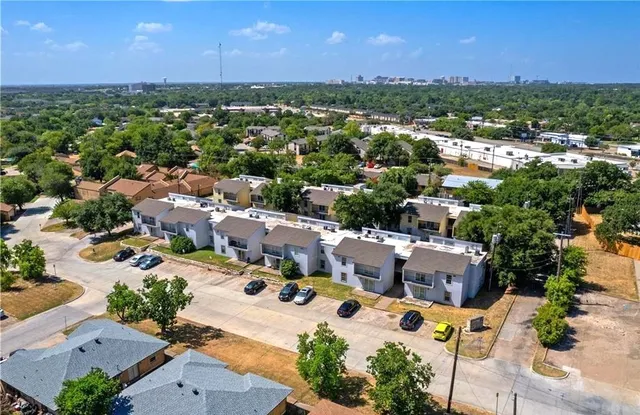 an aerial view of a city with lots of residential buildings