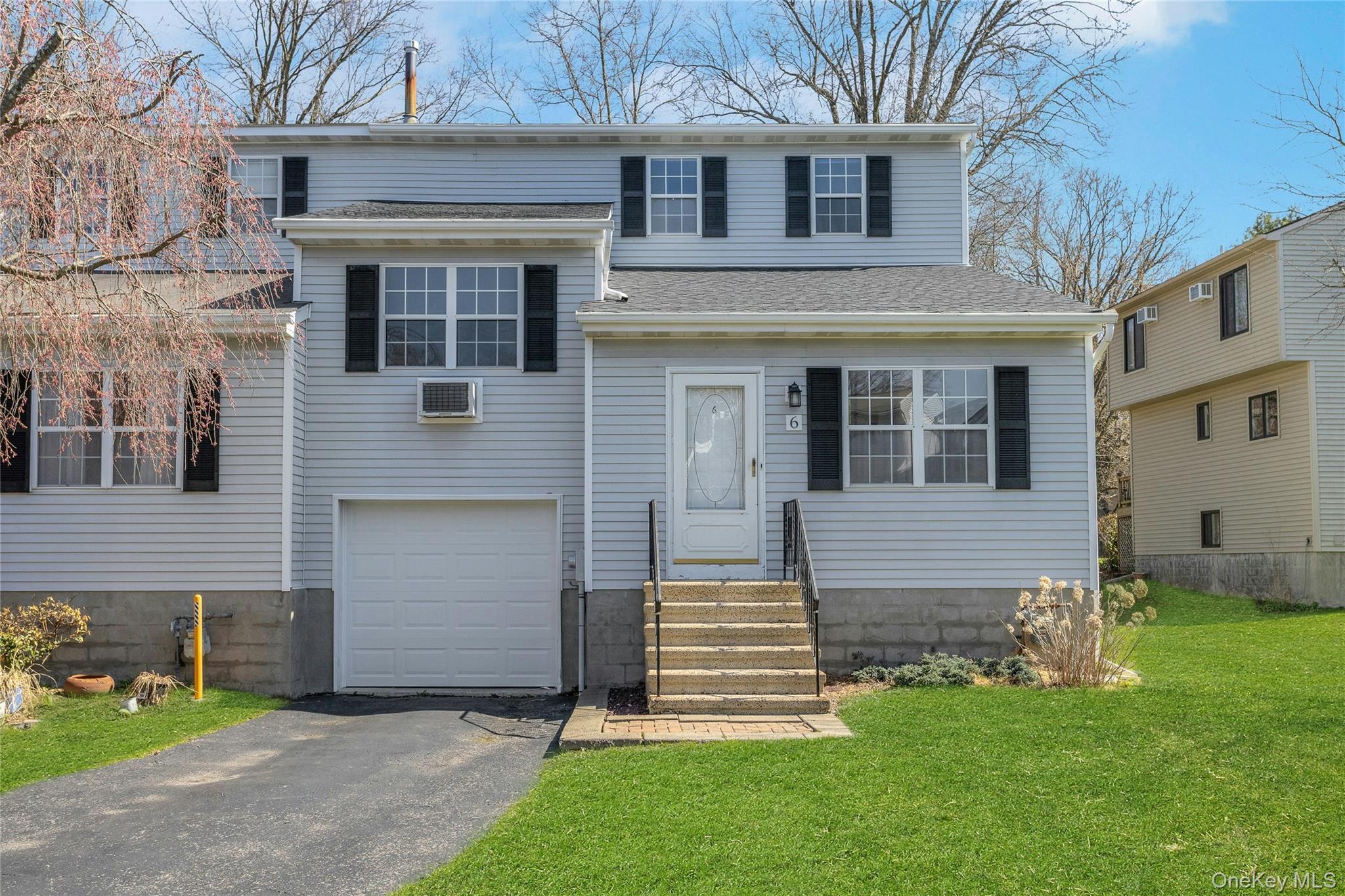 6 Elm Court Fishkill, NY 12524 - Photo 1 of 18 a front view of a house with a garden