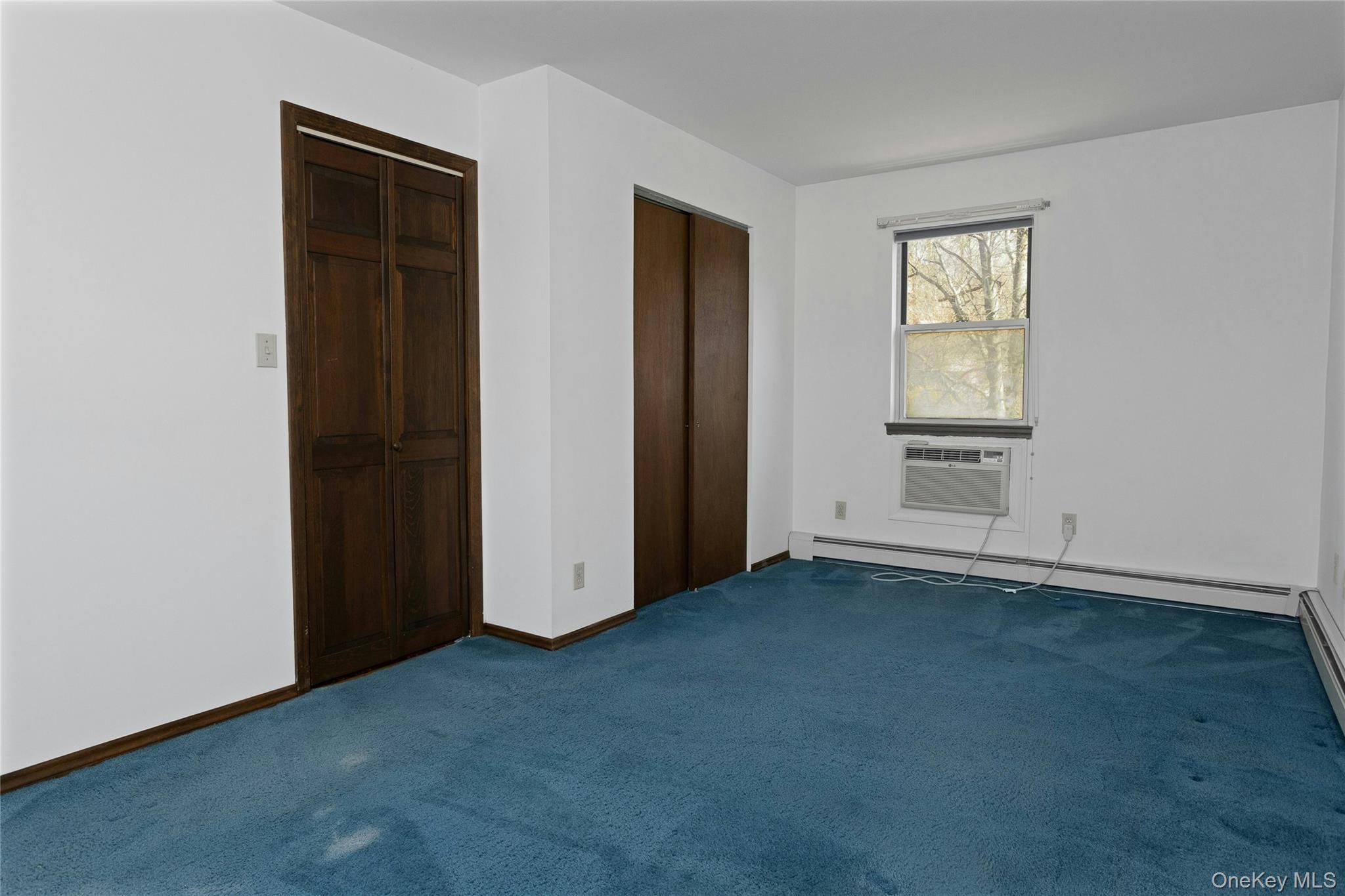 6 Elm Court Fishkill, NY 12524 - Photo 12 of 18 an empty room with windows