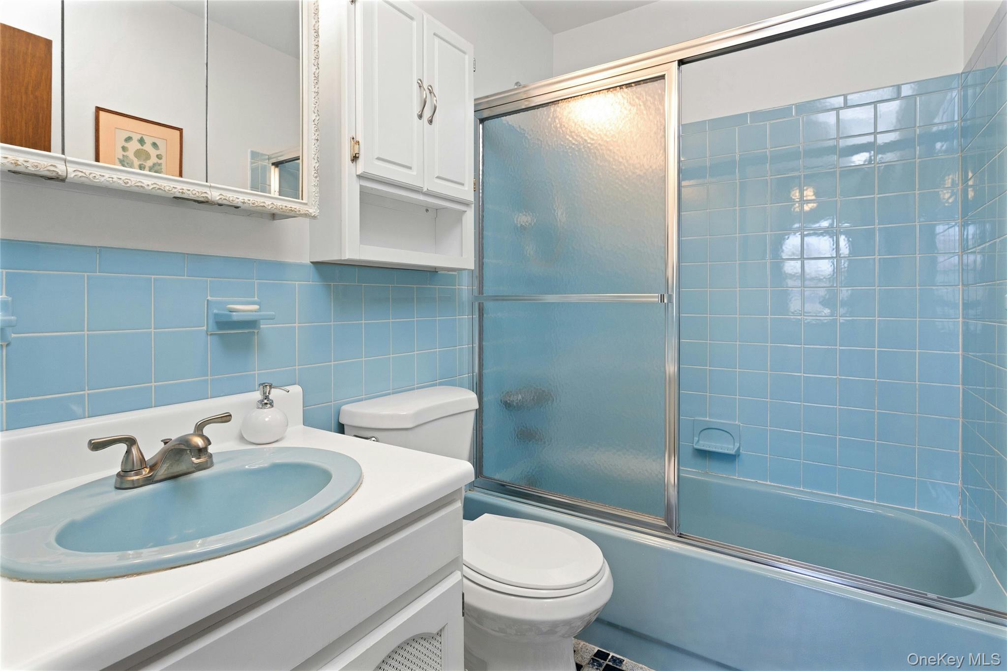 6 Elm Court Fishkill, NY 12524 - Photo 14 of 18 a bathroom with a sink toilet and shower