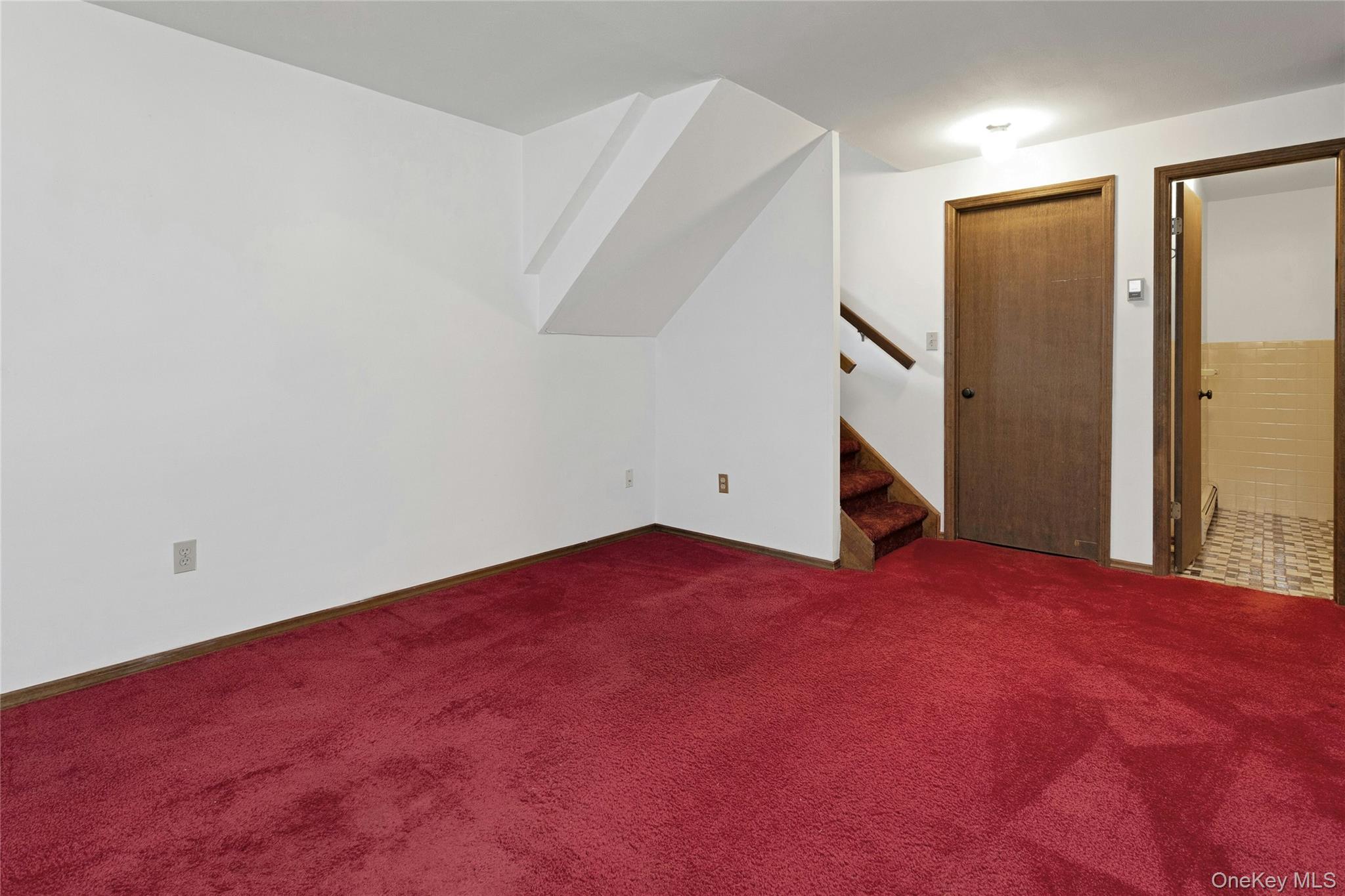 6 Elm Court Fishkill, NY 12524 - Photo 16 of 18 a view of empty room with wooden floor