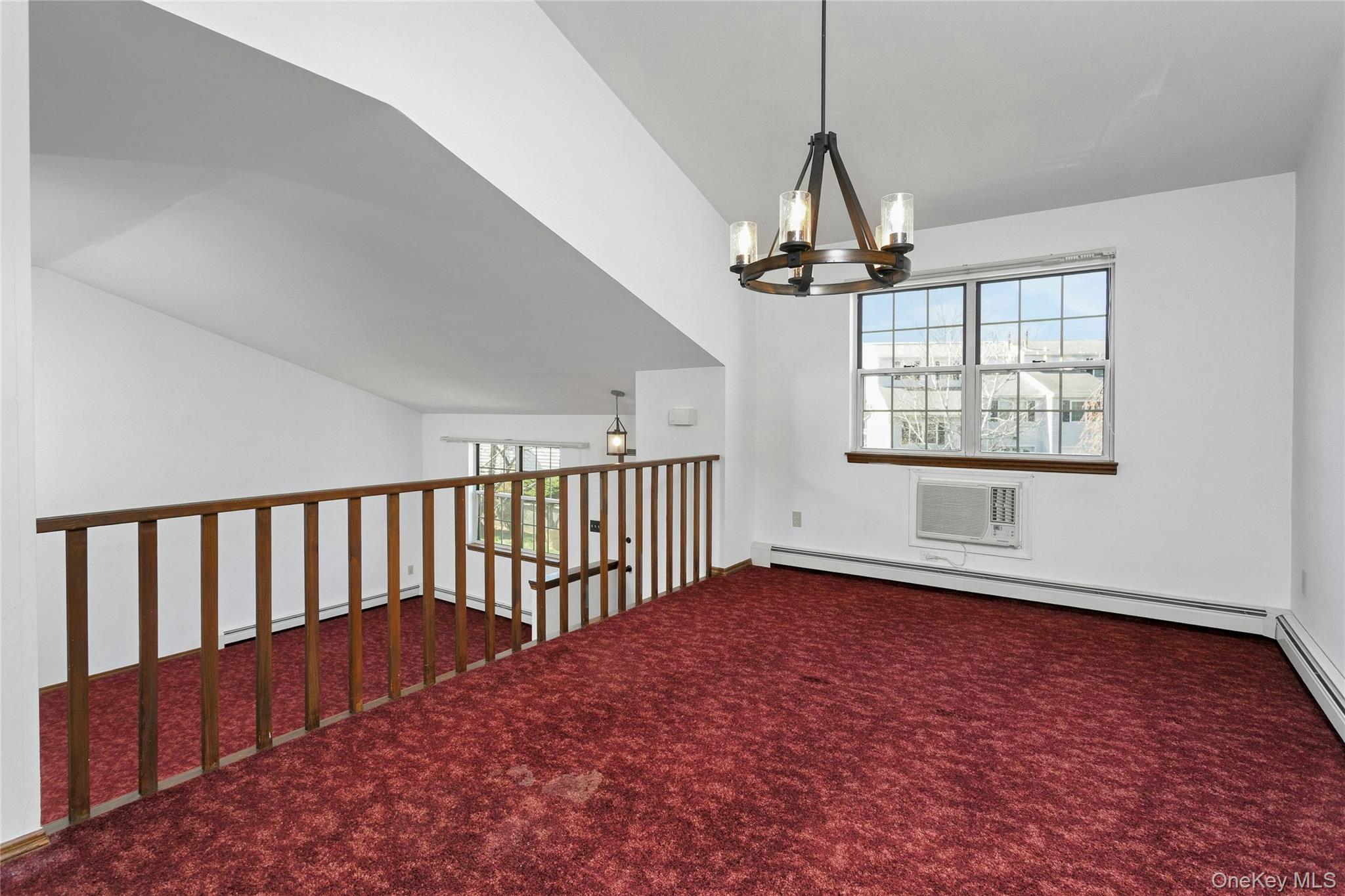 6 Elm Court Fishkill, NY 12524 - Photo 5 of 18 a view of empty room with wooden floor and fan
