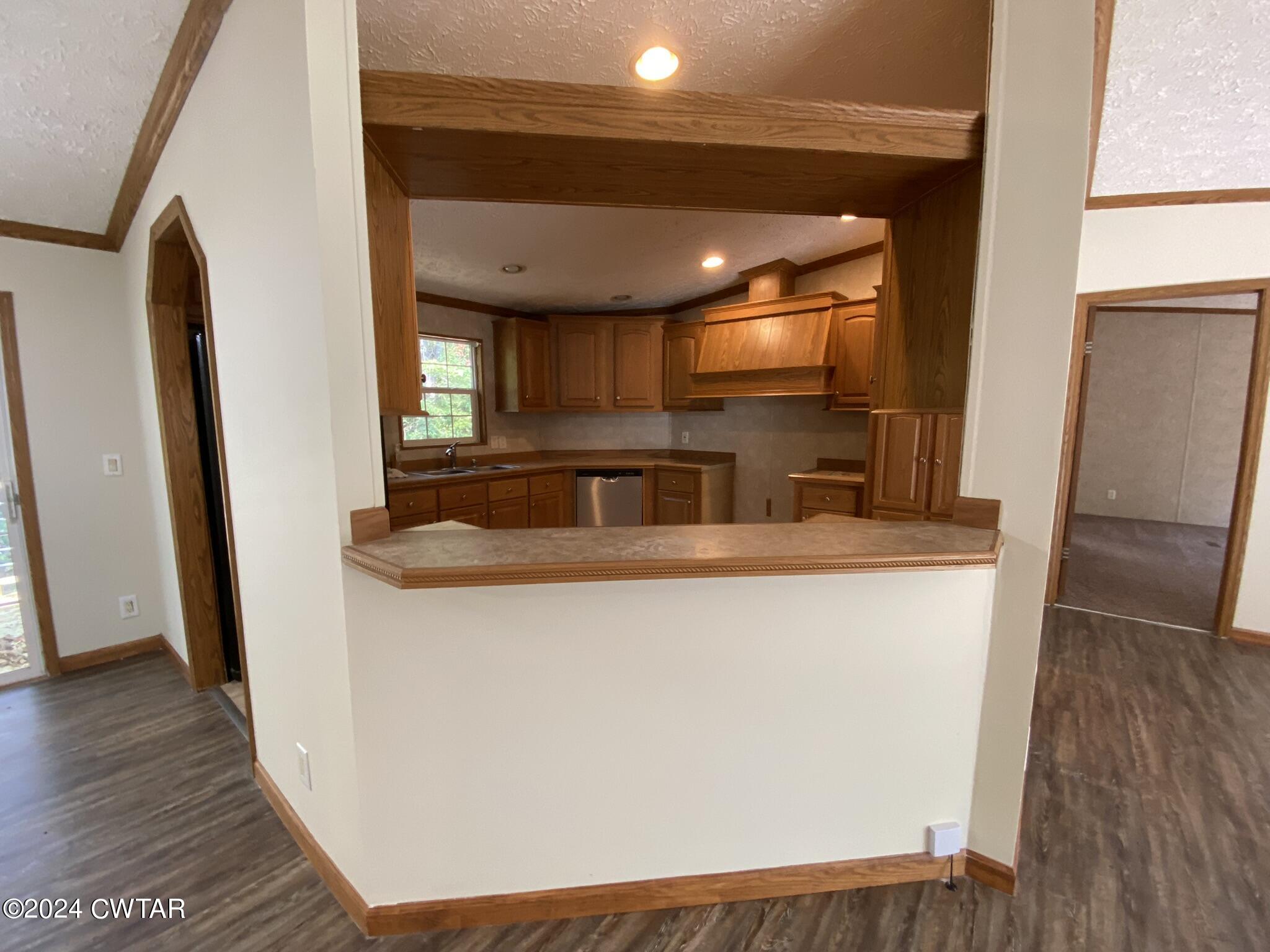 6555 Roby Road Enville, TN 38332 - Photo 6 of 22 a view of kitchen with sink and refrigerator