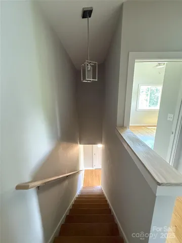 a kitchen with a sink a stove a microwave and cabinets