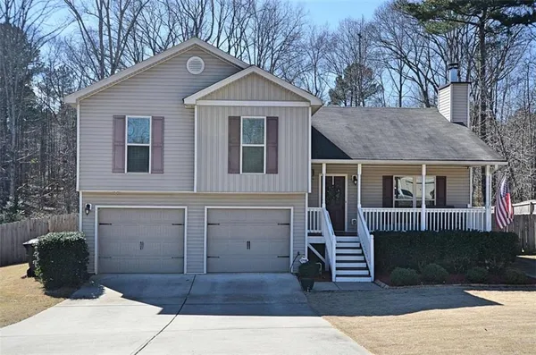 a front view of a house with garage