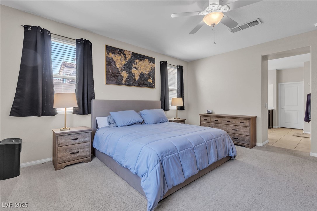 9950 Coyote Echo Court Las Vegas, NV 89166 - Photo 15 of 71 Carpeted bedroom featuring a ceiling fan and baseboards